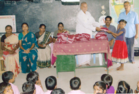 Mr. B. A. Rajarathinam distributing Uniforms to Sellagudapatti Elementary School Students